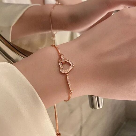 The Rose Gold Heart Chakra Slide Closure bracelet with heart pendant. - Picture 2 of 9